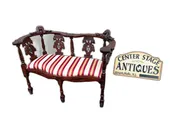 67469  Victorian  Style Carved Mahogany Settee with Figural Details and Upholstery