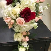Lovely cascade of roses, stock, and hydrangea