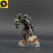 Armageddon Steel Legion Sergeant with Chainsword and Ork Head - #177020 - Mindtaker Miniatures