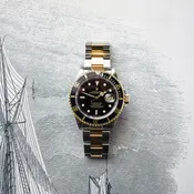 Rolex Submariner (Black & Gold) — Greco Jewelery, Watches, and Clocks