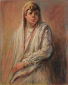 A young lad in a white robe