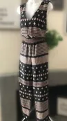NWT Long wide leg sleeveless jumpsuit black and gold with a V neck - $28 (67% Off Retail) New With Tags - From Victoria
