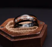 8mm Black Tungsten Ring With Cool Koa Wood Inlay and Sleek Silver Feathered Arrow