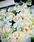 Claire with white roses, stock, hydrangeas, and sole mio