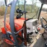 #1 Enclosed Tractor Gun Rack for Combines Ag Sprayers and More - The Gun Grabber