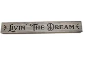 12″ Hand crafted sign that reads “Livin’ the dream”