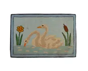 A Folk Art Hooked Mat of a Pair of Swans