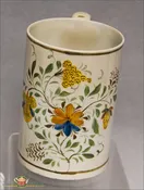 An Antique English Pearlware Mug decorated in underglaze enamel Pratt colors, c1790-1800