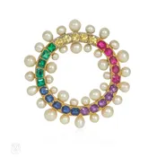 An Edwardian gem-set rainbow circle brooch
