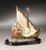 2 Sailors Sitting In Boat