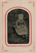 SITTING ON A WHEELBARROW