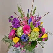 Green Hydrangea,Deep Lavender Stock,Yellow Daffodills,Hot Pink Rosesand Spring Pussywillows.
