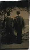 BACKS TO THE CAMERA