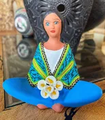 Hand painted clay doll with hand applied blue and yellow shawl