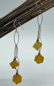 Elongated sterling silver hoop earrings with pineapple jasper cubes