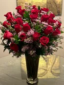 24 stem red roses and pink wax flowers