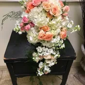 Cascade of roses, hydrangea, and stock