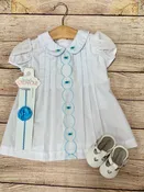 Turquoise rosebud baby dress