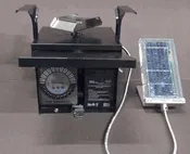 6 volt control unit with solar panel, timer, battery and slinger