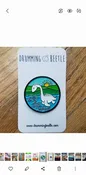 champ the lake monster enamel pin — Drumming Beetle