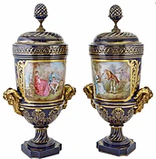 A Fine Pair of Sevres-Style Porcelain Two-Handled Urns and Covers