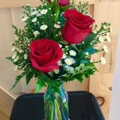 3 elegant roses in a vase