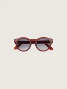 Sonnenbrille Cameron Panthos mit honigfarbenem Gestell, edlen Steinen und blauen Gläsern