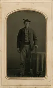 TALL GUY, TINY HAT.