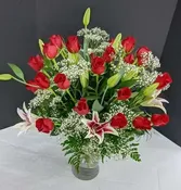 25 Roses plus lilies.