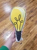 Light bulb throw pillow — Drumming Beetle