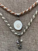 01-18-24 Basic Kumihimo Eight strands of fiber braided on a disc to make a necklace. Karen 10:30-12:30pm