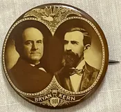 1908 STRIKING LARGE 1.75" BRYAN-KERN SEPIA JUGATE CELLO BUTTON EXC W/ RICH COLOR
