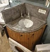 Soap stone bathroom corner sink.