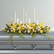 Candles And Flowers For The Casket
