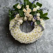 All white and blue Standing Wreath by Local florist