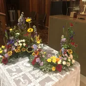 Eternal Garden-Our Modern take on the Classic Broken Wheel & the Formal Wreath, Surrounds the Urn and Photo of our Loved one in  garden of