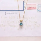 18ct Blue Topaz Pendant on 9ct Chain