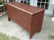 18th century 6 board blanket box original red finish with inside candle box it has rosehead nails double lock no key snipe hinges and cutout ends 17 by 44 inches 27 inches tall