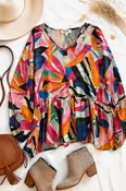Abstract Print Long Sleeve Peplum Blouse