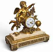 A Louis XVI Ormolu and White Marble Mantel Clock of Cupid