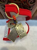 Keychain with copper coin and book