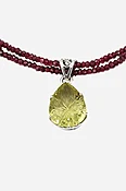 Carved Lemon Topaz on Garnet Pendant