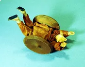 Antique toy clown rolling wheel toy