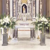 Ceremony pedestals with vases filled with flowers