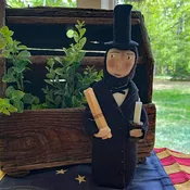 Abe Lincoln holding Scroll and Candle