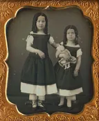 SISTERS & BABY DOLL.