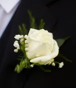 ROSE BOUTONNIERE TO MATCH DATE'S FLOWERS.