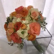 Lush and full bouquet of roses, hydrangea, succulents.
