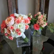 Compact design hydrangea, garden roses, ranunculus, roses.