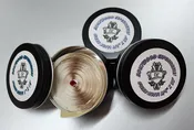Clear Butyl,  In Small, Convenient, Tin Cans